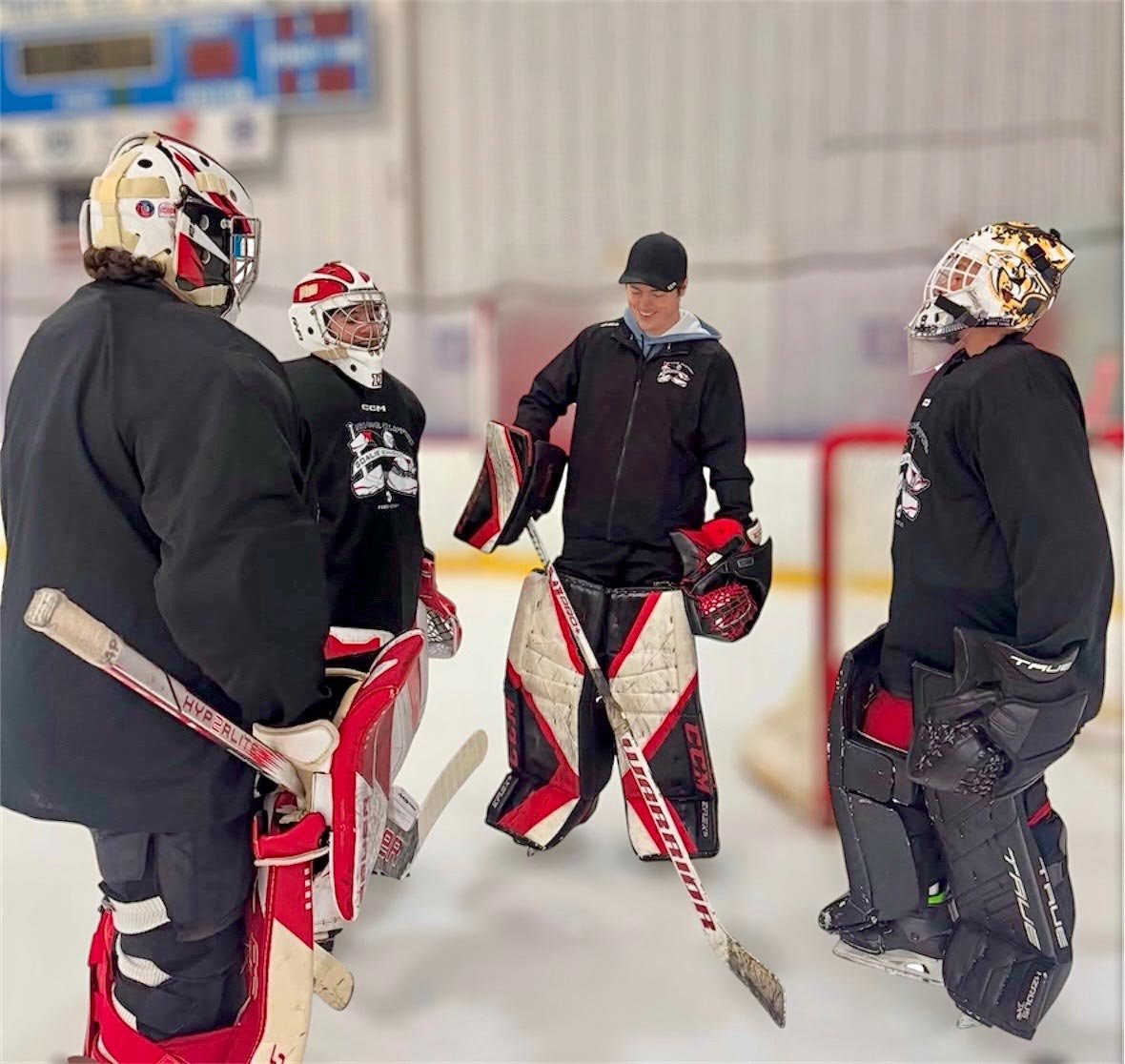Line of youth hockey goalies during practice — organization goalie development gaps Coach Utah partners solve